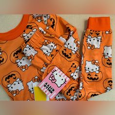 New With Tags! Adorable Orange Halloween Hello Kitty Pajamas. Size 4t. Very Soft/Smooth Fabric. Licensed Sanrio Product. So Sweet! Make Me An Offer! Playful Hello Kitty Print Sleepwear, Playful Orange Playwear Sets, Playful Orange Sleepwear For Sleepovers, Cute Fall Pajama Party Sets, Cute Pajama Party Sets For Fall, Playful Orange Loungewear Sets, Playful Halloween Sleepwear, Cute Cartoon Print Sets For Fall, Cute Cartoon Print Fall Sets