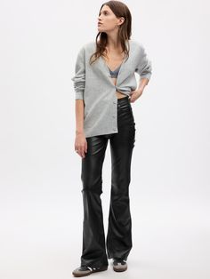 Fit: Snug & flattering through the hip & thigh with a flared leg. ​ Size down for a slimmer fit.  Fabric: 100% Polyester.  Stretch: Stretch Jeans.  A bit of hug & a lot of hold.  Comfortable & designed to flatter.  Rise: High Rise Jeans.  Look: A five-pocket vegan leather jean.  Details: Zip fly & five-pocket styling.  Our High Rise Jean has an 11" 28 cm) rise. ​ Slim through the hip & thigh.  Flared leg.  Full-length jean.  Hits below the ankle. ​ 21. 5" 55 cm) leg opening.  Inseam: Petite 30" Leather Jeans Outfit, 70s Flare Jeans, Sweater Styling, Faux Leather Jeans, Black Denim Pants, Black Flare Pants, Denim Outfits, Basic Sweaters, Leather Pant