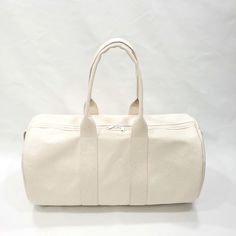 This beautiful round duffel made from a heavy weight cotton canvas will give you years of happy use. It's washable, carries great and is of high quality at an affordable price.If you have chosen personalization, please leave a note at checkout with the name you would like added. Material: Heavy Weight Cotton CanvasSize: 22" x 12"White Coil ZipperMade in the U.S.A.PROCESSING TIME:Your product will ship in 1-5 business days. Cotton Duffle Bag With Large Capacity For Overnight Trips, Cotton Weekender Bag With Large Capacity For Overnight Trips, Cotton Weekender Bag For Overnight Trips, Large Capacity Cotton Weekender Bag For Overnight Trips, Cotton Travel Bag With Canvas Lining For Overnight Trips, Practical Cotton Duffle Bag, Practical Cotton Duffle Bag For Everyday, Practical Everyday Cotton Duffle Bag, Casual Cotton Duffle Bag For Overnight Trips