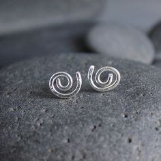 These adorable spiral stud earrings make the perfect gift for anyone with pierced ears. These earrings are perfect for a guy or a girl, anyone with multiple piercings, or just for everyday wear. They are quirky...They are fun! Here are the details about these earrings: The stud earrings are made from sterling silver wire and posts that are approximately 10mm in diameter. These earrings are NOT perfectly uniform...each pair is unique and not-quite-perfect spirals because they are handmade by me! 925 Earrings, Multiple Piercings, Dangly Earrings, Sterling Silver Earrings Studs, Pierced Ears, Sterling Earrings, Silver Wire, Ear Piercings, Sterling Silver Earrings