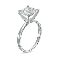 an engagement ring with a princess cut diamond in the center, on a white background