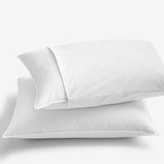 two white pillows stacked on top of each other