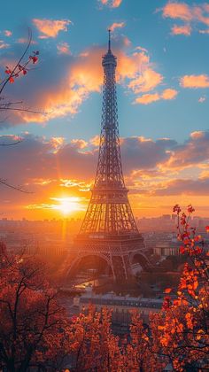 the eiffel tower in paris is shown at sunset as seen from above trees