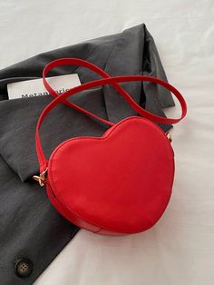 This romantic heart-shaped crossbody bag features a unique V-shaped embossed pattern, making it a stylish accessory for any woman. With its compact size and adjustable strap, it's the perfect bag for everyday use or a night out. Give your outfit a romantic touch with this must-have accessory. Color : Red Details : Tassel Type : Novelty Bag Bag Size : Mini Style : Casual, Cute Strap Type : Adjustable Pattern Type : Geometric, Plaid, Textured Pattern Closure Type : Zipper Features : Lightweight Material : PU Leather Strap Length Bag Length Bag Width Bag Height 115 20 8 17 Sequin Clutch, Red Details, Romantic Heart, Embossed Pattern, Rhinestone Clutch, Pu Leather Bag, Novelty Bags, Shoulder Chain, Black Tote