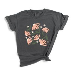 Looking for a cute versatile top to wear this summer? Make sure to grab one of our Pink Daisies garment dyed graphic tees! This soft and comfortable graphic tee is the perfect top for any outfit. It can be paired with biker shorts, jeans, or even a simple skirt/dress! This tee is true-to-size, so be sure to order your regular t-shirt size! If you are looking for a more oversized look, make sure to size up! Daisy Shorts, Pink Daisies, Simple Skirt, Pink Daisy, Shorts Jeans, Skirt Dress, Unisex Shorts, Biker Shorts, This Summer