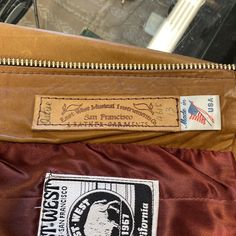 "Vintage 1970's \"East West Musical Instruments\" Leather Jacket. Tag Size 13. Please check the measurements below. Very good condition. Minor fading to liner. The label is \"East West Musical Instruments\". Original 1970's. East West leather jacket with curved drop pockets and side buckle details. All Sales Final. Please ask any questions before purchase. Take a look at our Store for more Vintage Clothing - VintageOnHollywood. MEASUREMENTS Shoulder to Shoulder: 16\" Underarm to Underarm: 17 1/4 Vintage Leather Jacket With Zipper, Vintage Leather Jacket With Zipper Closure, Vintage Biker Jacket With Zipper Closure, Rocker Jacket, Beatnik Style, Karen Robinson, 60’s Mod, Leather Jacket Vintage, 70s Hippie