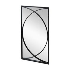 a black framed mirror on a white wall