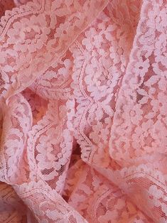 an image of pink lace fabric with flowers on it