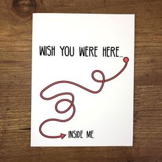 a card that says, wish you were here inside me on a wooden background with a red string