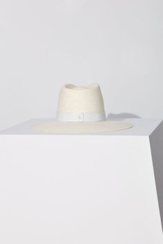 Details A classic fedora style made with packable straw. The structured fit creates a beautiful modern shape while staying true to the timeless design of our classic fedora. This effortless piece can easily be worn year-round and is meant for traveling with you wherever you go. · Brim: 3.75"· Crown: 5"· 1.25" Tonal Leather Band· Gold Screw Closure· Made in the USA· UPF 45+ Fit Runs true to size. If between sizes, we suggest sizing up. Fedora Style, Women Fedora, Janessa Leone, Leather Band, Innovation Design, Fedora, Timeless Design, Screw, Straw