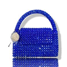 Artisan Beaded Handbag.Designed in NYC. Crafted with precision in the heart of Lagos, Nigeria.Elevate your style with our exquisite beaded handbags – a timeless accessory that seamlessly blends sophistication with versatility. Meticulously handcrafted, these bags are built to withstand the test of time. Whether paired with a cocktail dress, jeans and a tee, professional attire, or your favorite clubwear, our bead bags effortlessly complement any ensemble. Bead Bag, Dress Jeans, Lagos Nigeria, Beaded Handbag, Professional Attire, Timeless Accessories, Beaded Bags, Contemporary Fashion, Jewelry Bags