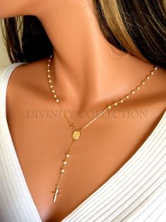 "gold rosary necklace, pearl rosary necklace, cross necklace women, gold cross necklace, Catholic rosary, confirmation gift, anniversary, meaningful, high quality, pearl necklace, Catholic jewelry This is an elegant rosary necklace made of 3mm Freshwater Pearls. Necklace has an oval 1/2\" Miraculous medallion at center with spring closure clasp attached. Necklace is made of 14kt gold filled. The length is the measurement around the neck, it does not include the drop. A small, delicate 14kt gold Elegant White Crucifix Necklace, Elegant Miraculous Medal Necklace, Elegant Jewelry With Miraculous Medal And Round Beads, Elegant Oval Necklace With Miraculous Medal, Elegant Yellow Gold Rosary With Crucifix, Elegant Oval Miraculous Medal Jewelry, Elegant White Miraculous Medal Jewelry, Elegant Gold Rosary For Anniversary, Elegant Cross Rosary For First Communion