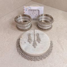 The Perfect Gift! This beautifully presented jewellery set includes our Silver Freda necklace set with a small set of matching bangles and elegant diamante Bindi pack. Ready to ship as seen with gift packaging as standard Ready to Ship Worldwide Bridal Survival Kit, Bangle Box, Ear Chain, Bridal Choker, Kundan Set, Bridal Necklace Set, Head Jewelry, Kundan Earrings, Nose Jewelry