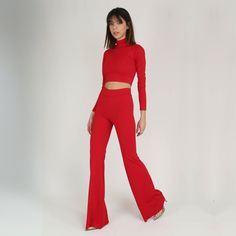 Red high waist bell bottoms pants and blouse set in Modern retro style. Our twin set can be a stylish choice that you can use day and night. It has a tight fabric but offers comfortable movement. Please share your body size with us! Be sure to send you the most suitable product. Model body measurements  Height: 1.76cm/ 5'9  Size: S/36    Bust: 88cm/34,51"  Waist: 62cm/24,5" Hips: 90cm/35,5" Size of the product on the mannequin: S/36/4-6 Inseam: 35"/89 cm     Total length: 47,1"/120cm You can specify inseam size. For the velvet version https://www.etsy.com/listing/921682516/red-bell-bottoms-velvet-pants-and-top?ref=shop_home_active_13&frs=1 All of our products are our own special designs. We have different colors and designs that you don't see. We can make many models for you with different Stretch Long Sleeve Pant Set For Party, Red Fitted Wide Leg Set, Fitted Red Bottoms Matching Set, Red Fitted Matching Set Bottoms, Fitted Red Matching Set Bottoms, Red Wide Leg Pants For Night Out, Stretch Wide Leg Sets For Night Out, Fitted Flare Party Sets, Fitted Cropped Pants Matching Set