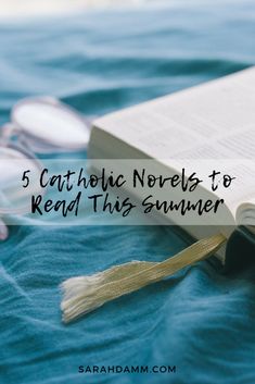 an open book with the title 5 catholic novels to read this summer