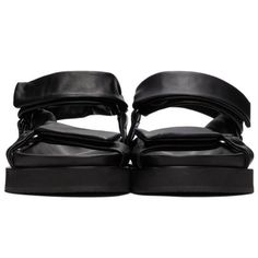 Jill Sander Black Sheepskin Sandals. Grained Nappa Sheepskin Sandals In Black. Butter Soft, Luxurious Leather. Open Round Toe. Adjustable Velcro Straps At Vamp And Ankle. Textile Logo Patch At Tonal Molded Leather Footbed. Tonal Treaded Rubber Sole. Silver-Tone Hardware. Black Calf Leather Sandals With Ankle Strap, Designer Double Strap Leather Sandals, Evening Double Strap Leather Sandals, Black Calf Leather Sandals For Spring, Black Calf Leather Sandals With Leather Footbed, Leather Sandals With Padded Heel And Double Strap, Leather Double Strap Sandals With Padded Heel, Double Strap Leather Sandals With Padded Heel, Black Flat Heel Calf Leather Sandals