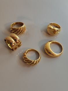 Because a lot of customer-friends love chunky rings, I made a collection of my wide rings. I hope you love these big golden rings. ♥ SIGN UP for 10% OFF your first order: https://bit.ly/3olIlWf ♥ DETAILS - Materials: Stainless steel, 18k gold plating. - Nickel-free, anti-corrosion, tarnish-resistant, and hypoallergenic. - Safe for sensitive skin. - Waterproof Ring: you can wear it while taking a shower or washing your hands. ♥ STYLE ⇨ A - Croissant Ring ⇨ B - Double Dome Ring ⇨ C - Themis Ring ⇨ Thick Ring Gold, Dome Rings Gold, Gold Chunk Jewelry, Lots Of Gold Rings, Chunky Rings Women, Bulky Gold Rings, Gold Right Hand Rings, Gold Y2k Rings, 18k Gold Rings