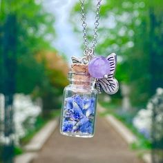 Natural Lavender Seeds (Dark Purple Color) In Small Glass Jar With Cork Stopper. 11mm (L) X 18 Mm (H) Amethyst Crystal Bead 6mm Diameter Eco Friendly Alloy Butterfly With Silver Antique Finish Rollo Chain, Stainless Steel 20” + 2” Extension Handmade Purple Necklace For Keepsake, Lavender Sterling Silver Healing Necklace, Lavender Sterling Silver Necklace For Healing, Purple Birth Flower Necklace For Gift, Jar Necklace, Lavender Seeds, Dark Purple Color, Small Glass Jars, Gold Lariat Necklace