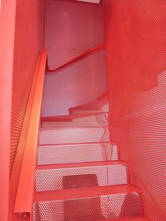 there is a red stair case in the building