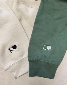 two green and white sweatshirts with i love playing cards embroidered on the front one