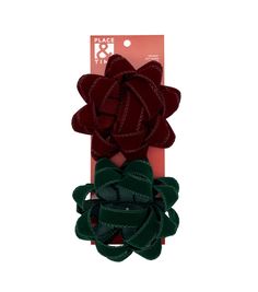 three pieces of red, green and black hair clips with bows on top of each one