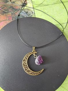 Moon pendant with Amethyst Cluster  Adjustable black cord Adjustable Moon Shape Necklace With Moon Charm, Adjustable Necklace With Round Moon Charm Pendant, Adjustable Necklaces With Round Moon Charm Pendant, Adjustable Crescent Necklaces For Festivals, Adjustable Purple Moon Phase Jewelry, Black Crystal Necklace With Adjustable Cord, Spiritual Black Crystal Necklace With Adjustable Cord, Adjustable Amethyst Pendant Crystal Necklace, Black Spiritual Necklace With Adjustable Length