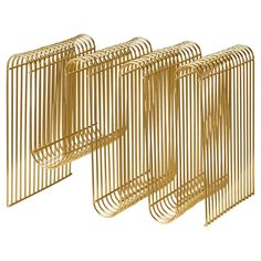 four gold metal bookends are lined up against each other on a white background