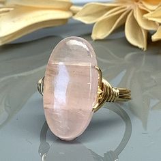 Rose Quartz Oval Statement Ring-Sterling Silver, 14k Yellow or Rose Gold Filled Wire Wrapped Ring -Custom Size (full, .25, .5, .75) by SimplyCharmed21 on Etsy Handmade Oval Rose Gold Rings, Adjustable Rose Quartz Rose Gold Ring, Pink Oval Spiritual Ring, Oval Rose Gold Crystal Promise Ring, Oval Rose Gold Crystal Ring For Anniversary, Rose Gold Oval Crystal Promise Ring, Spiritual Oval Rose Gold Jewelry, Oval Wire Wrapped Rings For Gifts, Oval Wire Wrapped Rings As Gifts