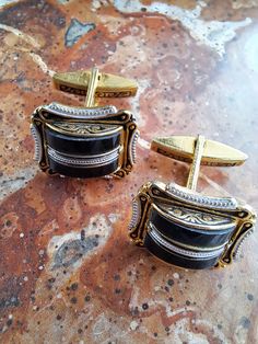 This is a very striking pair of gold tone g damascene cufflinks.They are Spanish and were made in the 1960s era.They are made of gold tone metal and faux glass ebony.The cufflinks are rectangular in shape 2cm x 1 5cm in size.There is lovley detail in the decoration.The cufflinks are in very good condition with just a little wear and tear.The swivel mechanism works well on both..Please study the pictures and check the sizes.They come with a velvet drawstring bag. We opened our art/vintage jewelry Antique Engraved Cufflinks For Formal Occasions, Antique Engraved Cufflinks For Formal Wear, Antique Hallmarked Cufflinks For Formal Occasion, Antique Hallmarked Cufflinks For Formal Wear, Antique Cufflinks For Business, Antique Cufflinks For Anniversary, Antique Hallmarked Cufflinks For Wedding, Hallmarked Antique Cufflinks For Wedding, Antique Cufflinks For Formal Wear