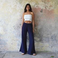 These Palazzo Pants for Women offer the perfect combination of sophisticated elegance and rebellious style, making them a versatile addition to any summer wardrobe. They are handmade with high-quality double gauze cotton fabric that has a crinkled/ waffle texture, giving them a unique look. The elastic waist and two side pockets ensure superior comfort and convenience. These pants are available in various size options, including plus sizes and tall lengths. The dark blue / navy color is perfect Chic Wide Leg Pants For Day Out, Stretch Solid Color Summer Dress Pants, Summer Solid Straight Dress Pants, Summer Harem Pants For Day Out, Chic Non-stretch Ankle-length Harem Pants, Versatile High-waisted Wide Leg Pants For Day Out, Summer Straight Dress Pants, Chic Summer Pants, Chic Solid Color Wide Leg Harem Pants