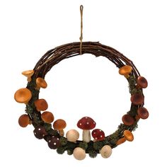 a wreath with mushrooms hanging from it