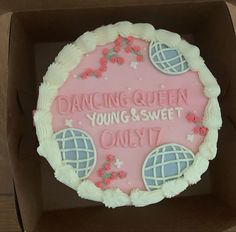 a cake in a box that says dancing queen young and sweet only 7 / 7