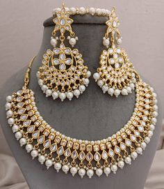 DESCRIPTION White Pearls Necklace Earrings Tikka Set, Kundan Necklace Earrings Tika Set, Gold Plated Jewelry, Bridesmaid Jewellery Bridal Engagement Set ITEM DESCRIPTION Metal        = Gold Plated Occasion  = Wedding ,Party Wear, Bridal Color        =  White and Yellow Size          = Necklace Length = 7 Inches Long, Earring Size = 3.5 Inches Long, tikka - 6 Inches Long Free Shipping White Kundan Jewelry Sets With Matching Earrings, Kundan Bridal Necklace With Matching Earrings For Wedding, Chandbali Jewelry With Elegant Design For Wedding, White Kundan Bridal Earrings For Marriage, Chandbali Bridal Necklace With Pearl Drop For Wedding, Elegant Chandbali Jewelry For Wedding, Elegant Chandbali Wedding Jewelry, White Bridal Earrings For Festivals And Anniversary, White Bridal Earrings For Festivals And Anniversaries