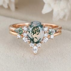 a close up view of a ring with an image on the side and diamonds around it