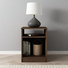 a lamp is sitting on top of a book shelf