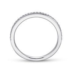 a white gold wedding band with pave set diamonds on the top and bottom edge