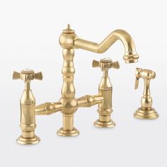 an antique style faucet with two handles and three spouted valves, in gold