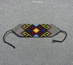 a beaded headband with an image of a colorful diamond pattern on the side