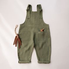 Kids linen gender neutral dungarees with adjustable straps and front pockets. This item is MADE TO ORDER. Please allow up to 3-7 business days production time before shipping.  Material: 100% medium weight linen, Oeko-Tex 100 certified. Size Chart (this item runs true to the size): Newborn (52 cm / 20.5 in. height) 0-3 months (62cm / 24in. height) 3-6 months (68cm / 27in. height) 6-12 months (80cm / 31.5in. height) 12-18 months (84cm / 33in. height) 18-24 months (90cm / 35in. height)  2-3 YRS (96cm / 38in. height) 3-4 YRS (104 cm / 41in. height) 4-5 YRS (110cm / 43in. height) 5-6 YRS (116cm / 45.5in. height) Recommended Care Instructions: Machine wash cold water, delicate cycle, dry gentle. Cotton Jumpsuits And Rompers With Adjustable Straps, Cotton Jumpsuit With Adjustable Straps And Bib Front, Utility Solid Overalls With Pockets, Utility Overalls With Pockets, Cotton Utility Jumpsuits And Rompers For Summer, Utility Cotton Jumpsuits And Rompers For Summer, Summer Utility Cotton Jumpsuits And Rompers, Summer Bib Front Shortalls With Pockets, Cotton Bib Front Overalls In Solid Color