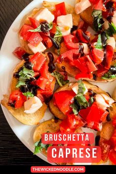 the bruschetta caprese is topped with tomatoes, olives and mozzarella