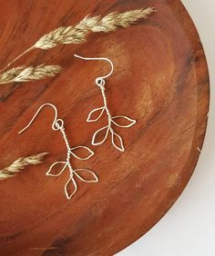 Beautiful handcrafted, branch shaped, silver wire earrings Super lightweight and dainty, you can hardly tell you're wearing them! Measurements: 4.5cm including hook 0.5mm wire Silver plated french hooks The designs may differ ever so slightly due to the nature of the wire and the shaping process.  All orders will arrive neatly, wrapped in ecofriendly friendly packaging If you are ordering as a gift, please let us know at the checkout and we can arrange to add a personalised note in your order for you if you wish Wire Earring Shapes, Wire Earring Designs, Wire Earing Ideas, Diy Necklace Wire, Wire Leaf Earrings, Wire Jewelry Patterns Earrings, Delicate Nickel-free Threader Drop Earrings, Delicate Nickel-free Drop Threader Earrings, Delicate Silver Threader Earrings For Everyday