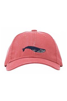 a pink hat with a whale embroidered on it