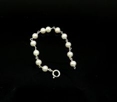 925 sterling silver customized solid silver pearls baby bracelet, excellent gift for new born baby, stylish jewelry from india.Metal-925 sterling silver.Item type-Baby braceletLength-4.5 inches.pearl size-5 mm approx.Weight-3.140 grams.Stamped-925.Makes excellent gift for baby, birthday, Christmas day. Adjustable Sterling Silver Bracelet With Pearls For Gift, Pearl Bracelets With Silver Beads As A Gift, Adjustable Sterling Silver Pearl Bracelet For Gift, Pearl Bracelets With Silver Beads For Gifts, Gift Pearl Bracelets With Silver Beads, Sterling Silver White Gold Bracelets With Pearl Chain, White Gold Sterling Silver Bracelets With Pearl Chain, Classic Silver Beaded Jewelry As Gift, White Gold Sterling Silver Bracelet With Pearl Chain