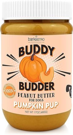 a jar of peanut butter sitting on top of a white table next to an orange pumpkin