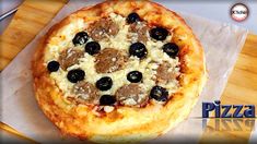 a pizza sitting on top of a wooden cutting board