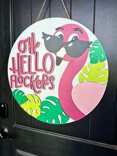 a flamingo door hanger with the words oh hello fleckers on it