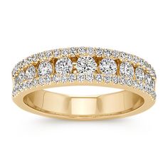 Classic brilliance at its best; this ravishing wedding band features diamonds of varying sizes as the center isle and is outlined by additional diamonds. This band showcases 63 round diamonds  at approximately .75 carat total weight  that have each been hand-matched for sparkle and crafted in quality 14 karat yellow gold. She is sure to dazzle every day with this breathtaking channel-set band. Beautiful Wedding Bands, Wedding Expenses, Classic Wedding Band, Bold Rings, Wedding Bar, Fine Jewelry Collection, Channel Set, Classic Wedding, Diamond Band