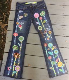 This is a custom listing for you... send me your jeans These specific jeans are sold but I can make you a cool pair that will be inspired from these! I can make these for you in any size - just send me your jeans The jeans that I will make for you will have hippie flowers/stems and flowers... .along the front of the legs as seen in the photo - they will not be these specific jeans or flowers. added distressed/ripped and repaired jean patches make these jeans look even more boho hippie I will wor Spring Fitted Jeans With Patchwork, Spring Fitted Patchwork Jeans, Fitted Patchwork Jeans For Spring, Fitted Multicolor Denim Jeans, Fitted Multicolor Jeans For Spring, Multicolor Mid-rise Denim Jeans, Denim Decorations, Jeans Decorados, Upcycled Wardrobe