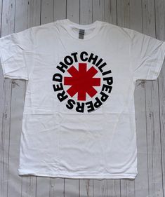 💎 Brand new officially licensed Red Hot Chili Peppers Classic Asteris White T-Shirt New Unisex 💎New without Tags  💎All of our items are 100% officially licensed and 100% authentic. 💎 All our imagery is taken live of the physical item, to give a real life image of the product. 💎Limited sizes and availability, grab yourself a great deal before it is too late 💎All our items are in stock and ready to be sent out right away from our UK warehouse. Red Hot Chili Peppers Shirt, Red And White Shirt, Life Image, Hottest Chili Pepper, Red Hot Chili Peppers, Chili Peppers, Fan Shirts, Hot Chili, Band Shirts