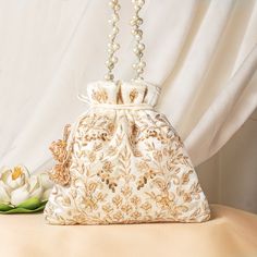 a white purse sitting on top of a table